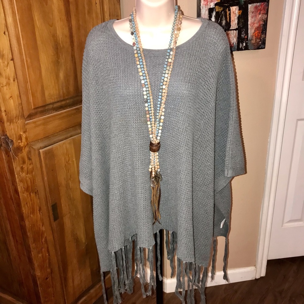Gray poncho with wood buttons on the side